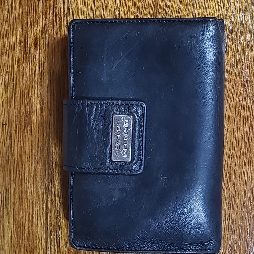 Vintage stone Mountain black leather trifold wallet.